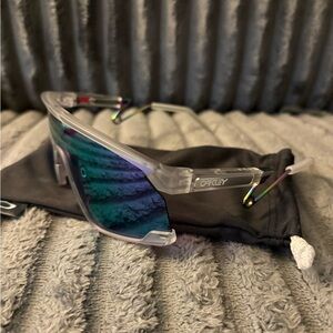 Oakley Clear Frame Sunglasses with Iridescent Blue Lenses